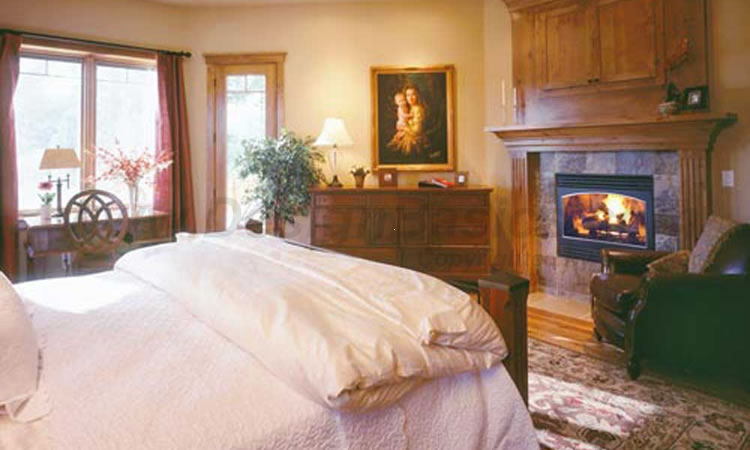 master bedroom with fireplace