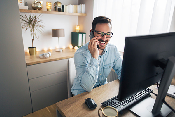 home office with man working at desk